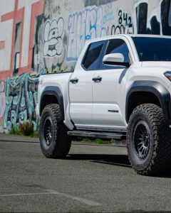BFGoodrich All-Terrain T/A KO3 tire mounted on a Toyota Tacoma, showing aggressive tread design and durable sidewall construction for off-road performance.