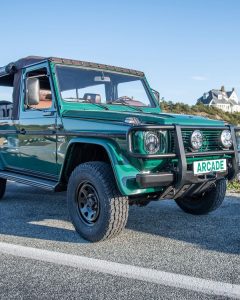 Classic green Mercedes G-Class equipped with Vredestein Pinza AT tires, photographed by Arcade, blending urban luxury with off-road style appeal.