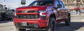 BFGoodrich KO3 tire on a red Chevy Silverado showcasing aggressive tread and rugged stance.